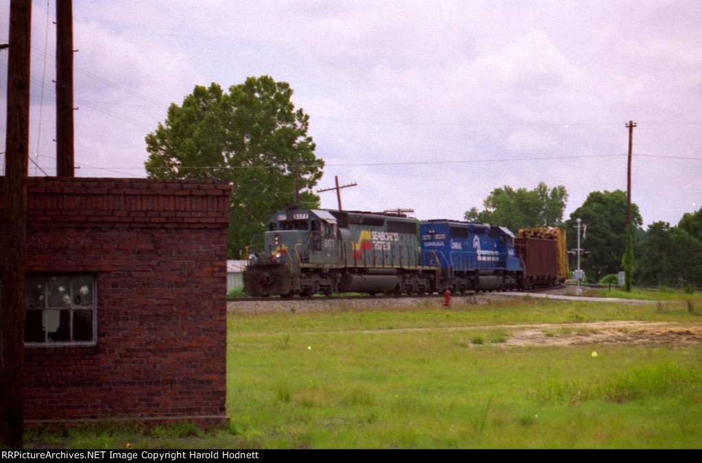 CSX 8177 leads a train across Bridges Street